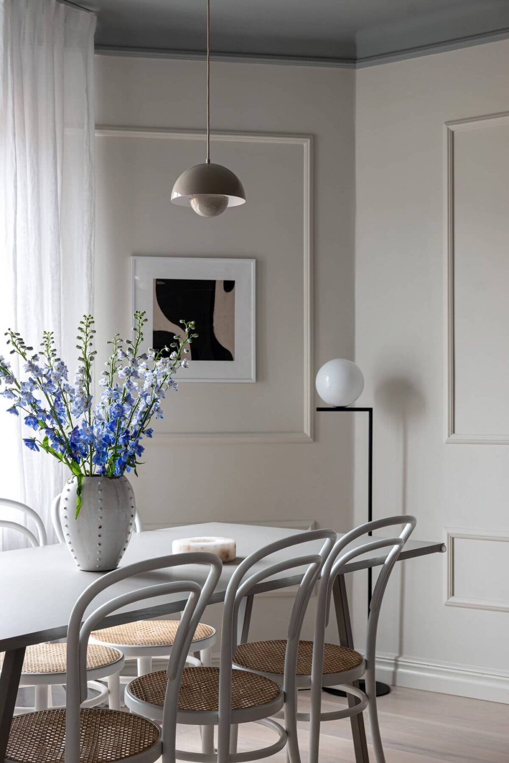 A Stylish Renovated Stockholm Apartment with Built-In Storage 6 light gray living room with dining table