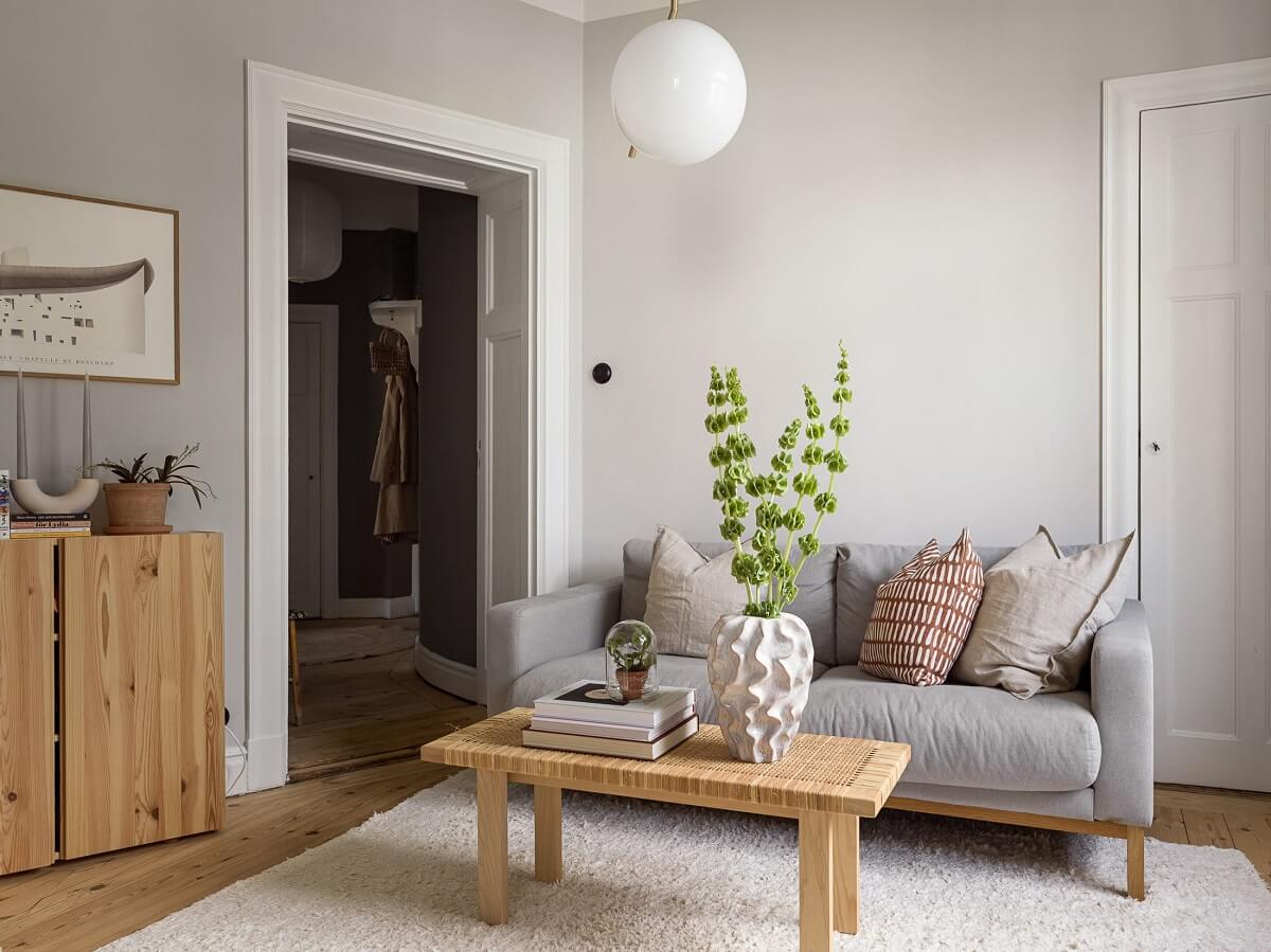 A Gray Stockholm Apartment with a Black Kitchen 4 light gray living room with wooden furniture