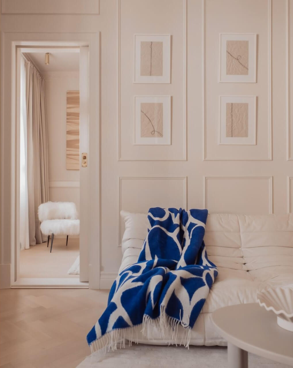 A Serene and Luxurious Apartment in Stockholm 4 light living room with blue throw