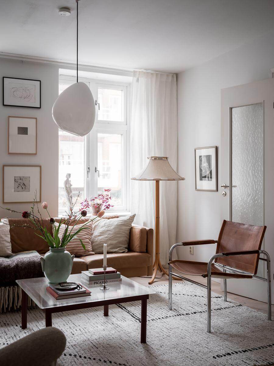 A Light Two Bedroom Apartment in Gothenburg 8 light living room with leather sofa nordroom