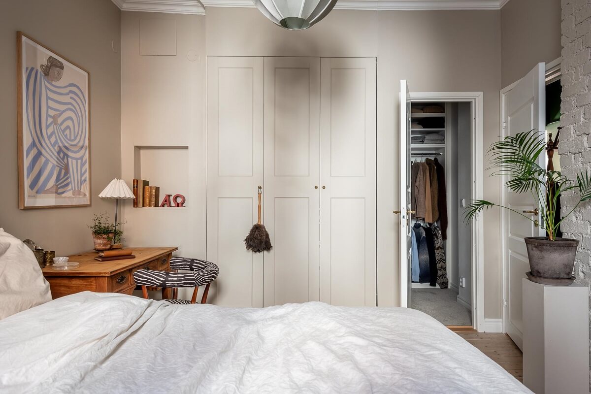 A Turn of the Century Apartment with a Green Kitchen 18 light serene bedroom with desk