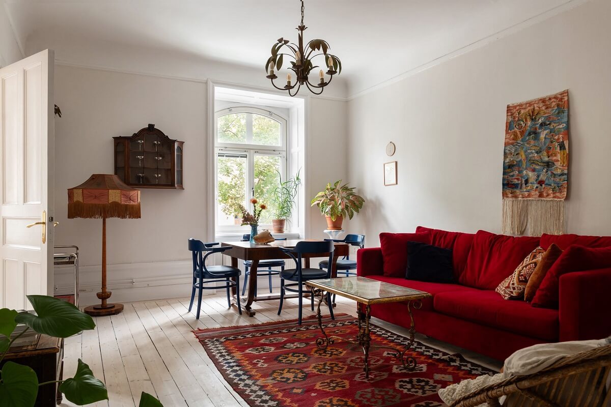A Swedish Apartment with a Yellow Kitchen 8 liivng room with red sofa