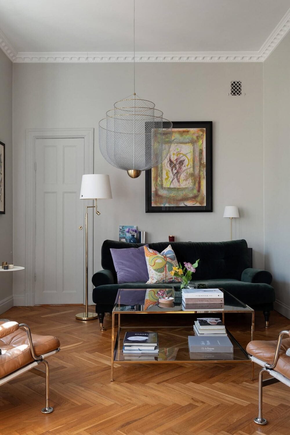 An Elegant Turn-of-the-Century Apartment in Stockholm 13 living room light gray walls and green velvet sofa nordroom