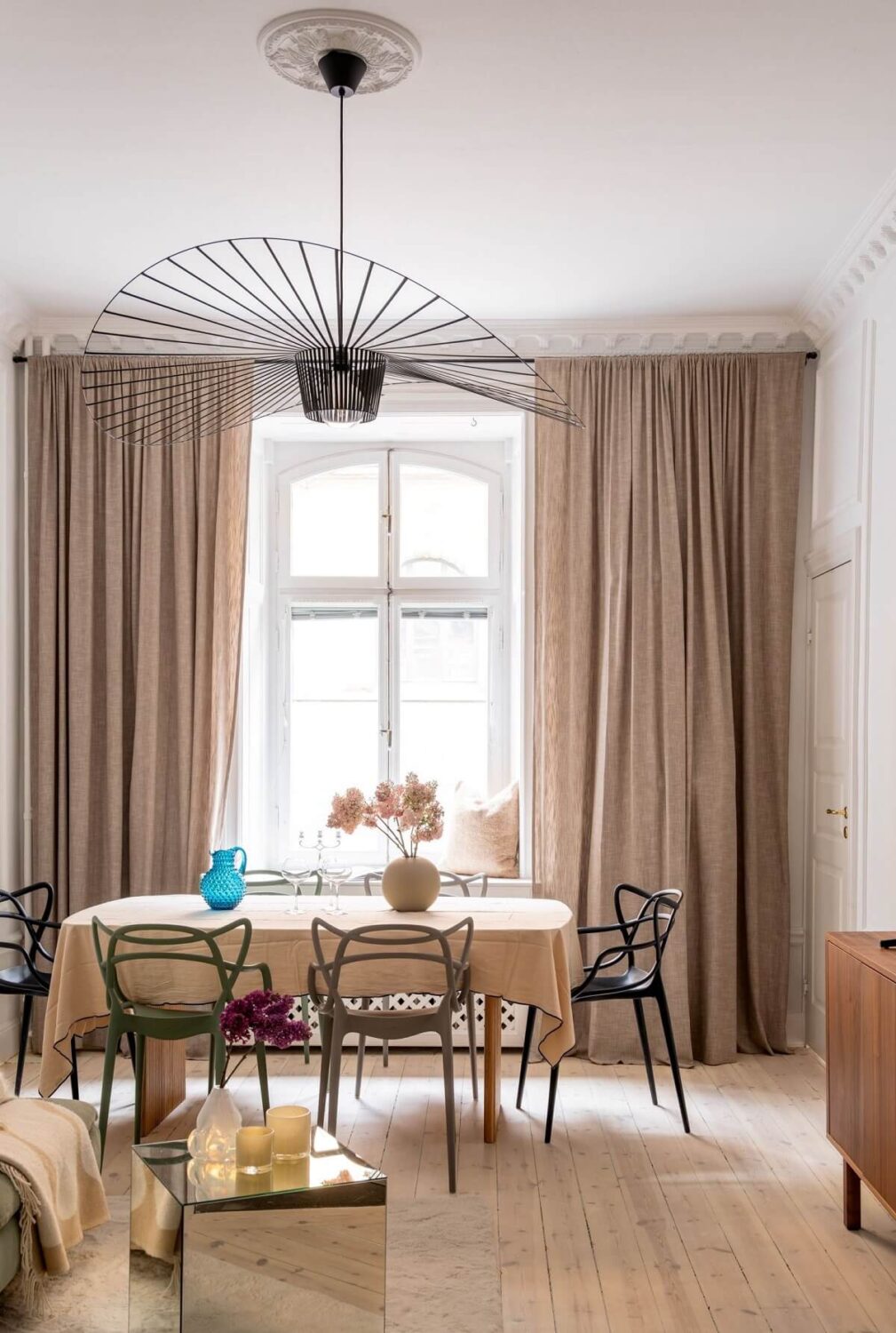 A Small, Tastefully Renovated Apartment in Stockholm 5 living room sand colored curtains nordroom