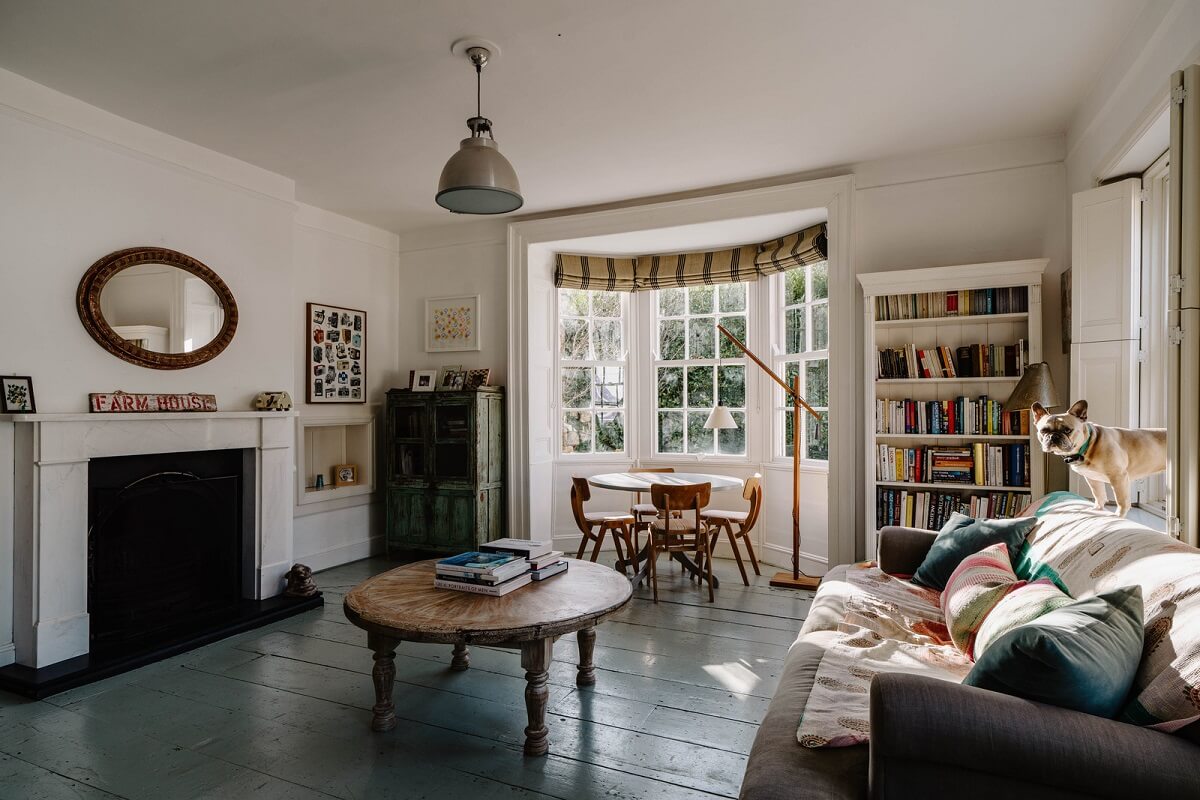 An 18th-Century Historic House with an Amazing Kitchen 10 living room with bay window and painted floorboards