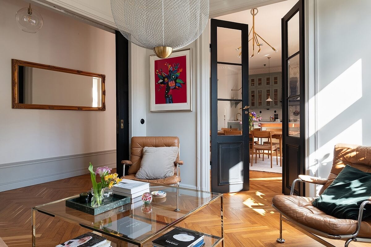 An Elegant Turn-of-the-Century Apartment in Stockholm 15 living room with black wooden glass doors