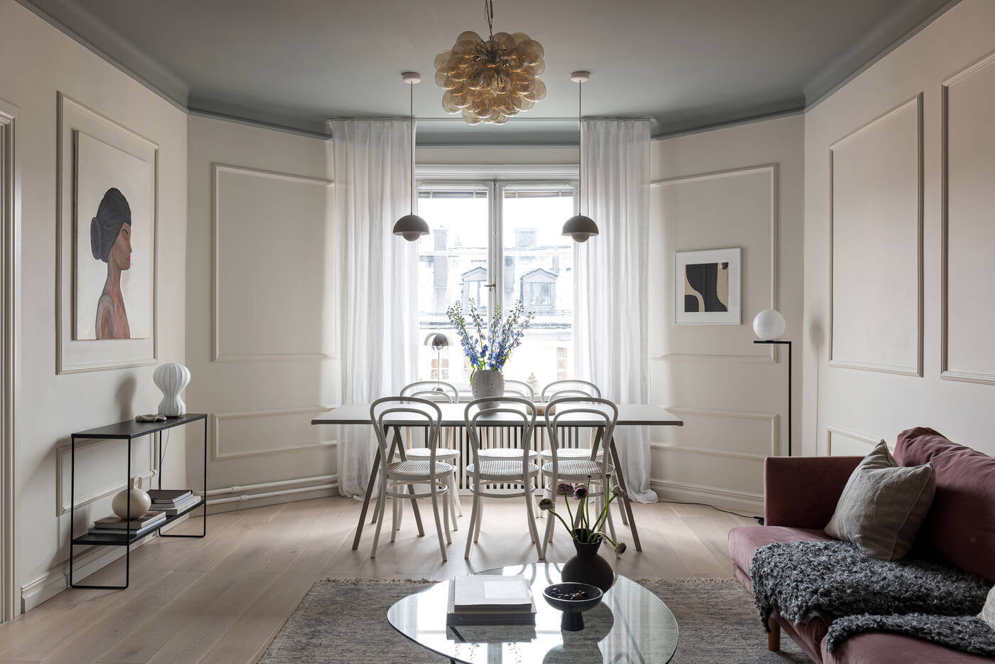 A Stylish Renovated Stockholm Apartment with Built-In Storage 5 living room with dark painted ceiling