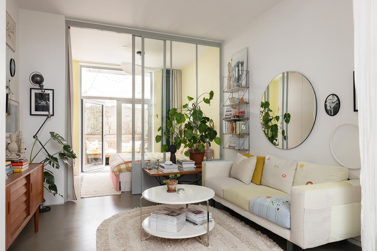 A Unique Basement Apartment in Stockholm 2 living room with glass wall