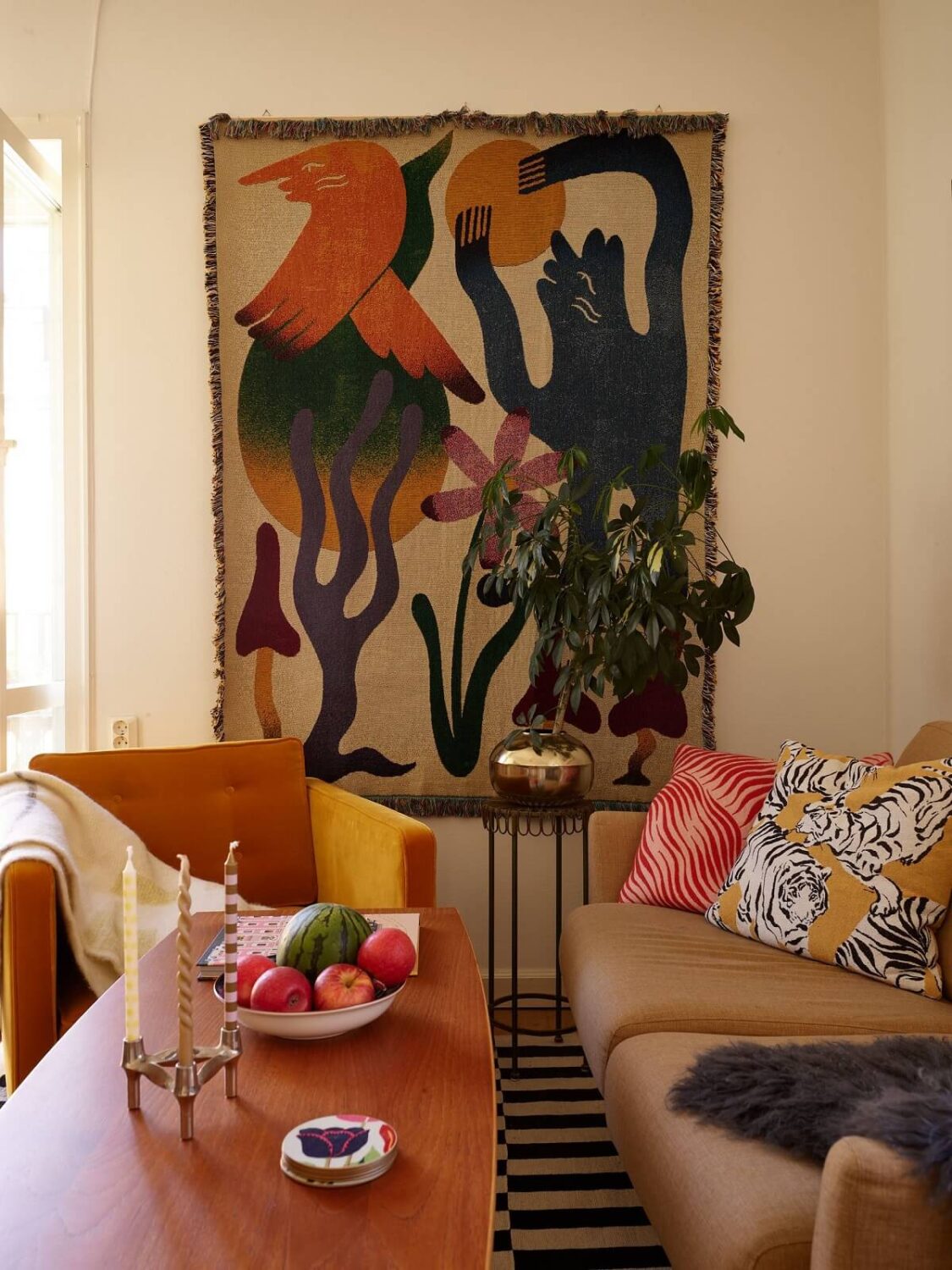 A Vintage Apartment with a Vibrant Blue Bedroom 2 living room with large art and yellow chair