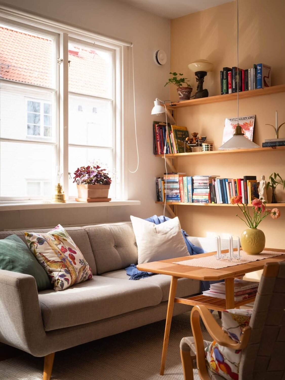 Warm Orange Tones in a Small Apartment 3 living room with light orange wall