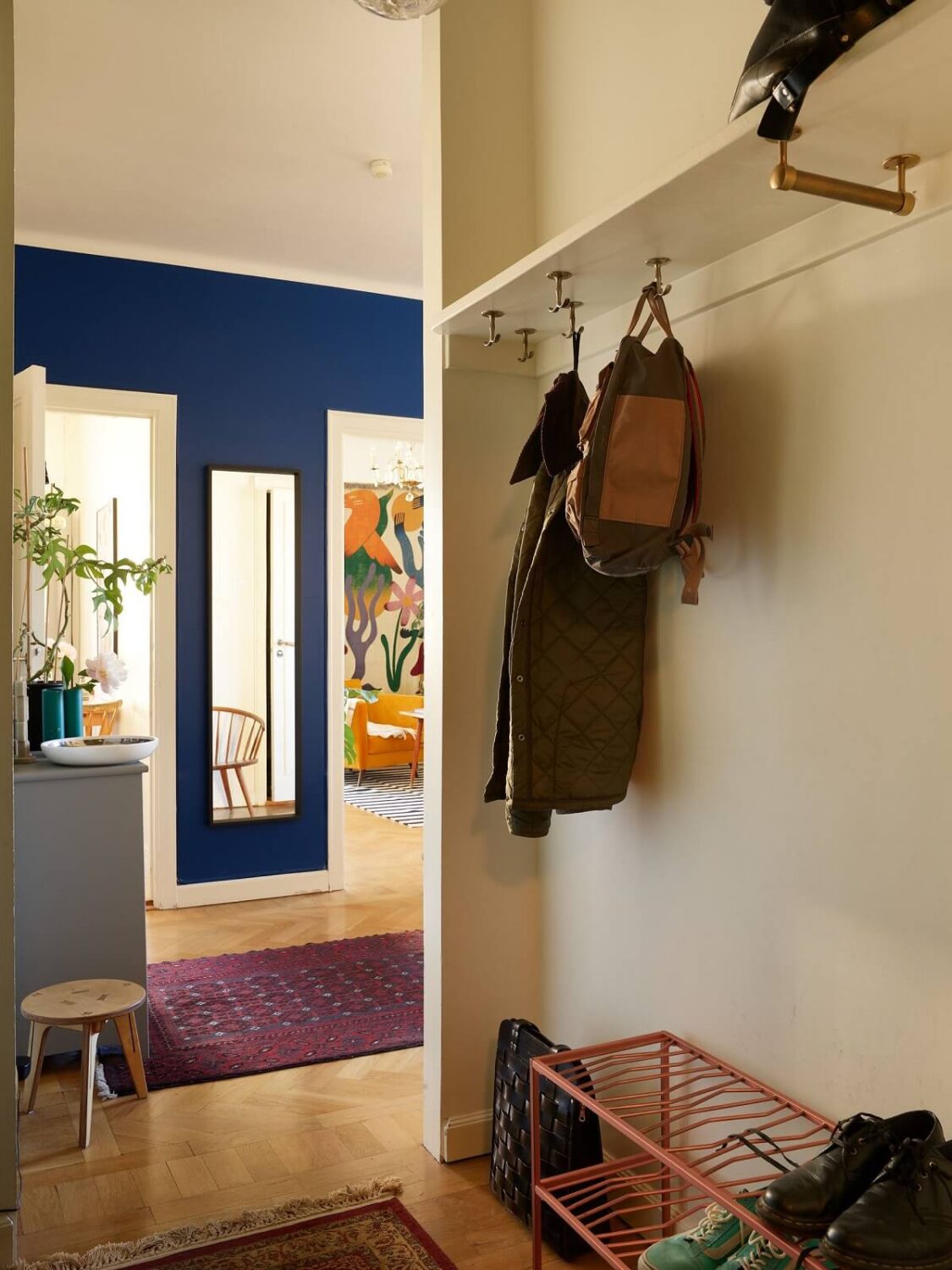 A Vintage Apartment with a Vibrant Blue Bedroom 16 living room with shelf