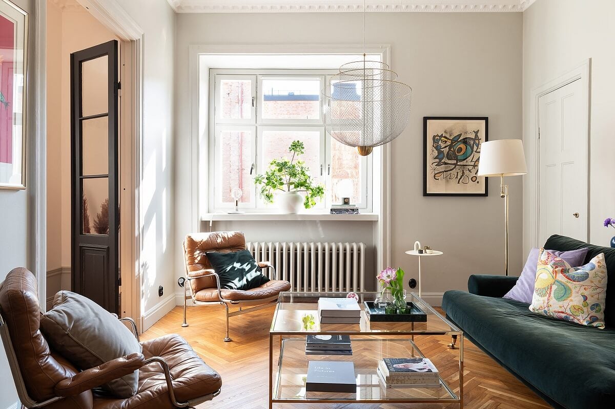 An Elegant Turn-of-the-Century Apartment in Stockholm 14 living room with velvet sofa