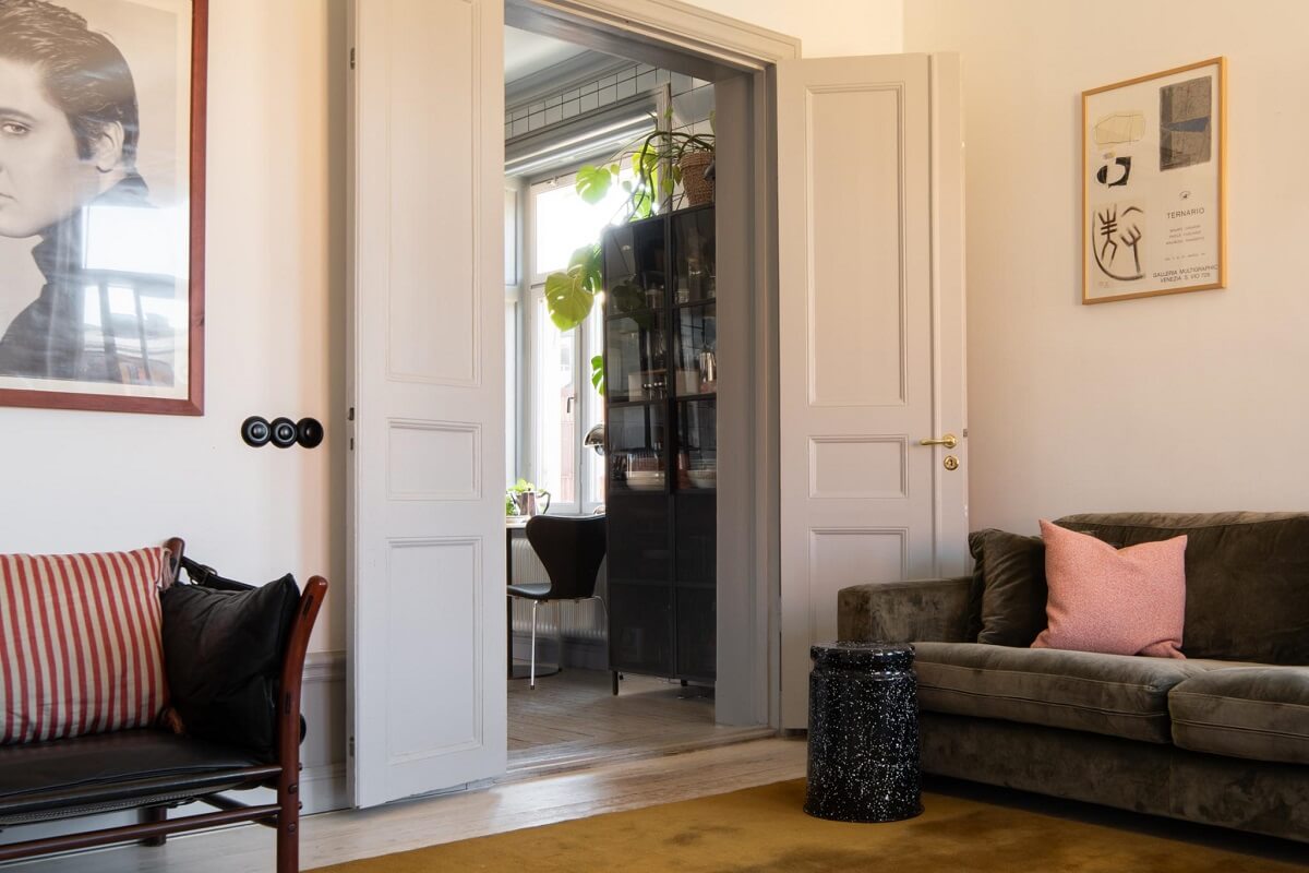A Corner Apartment with an Industrial Style Kitchen 8 living room with wooden doors