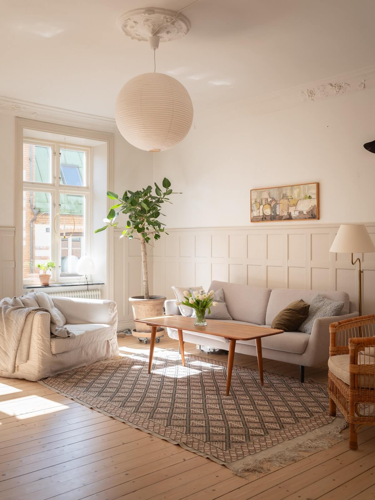 living room with wooden floor and large windows
