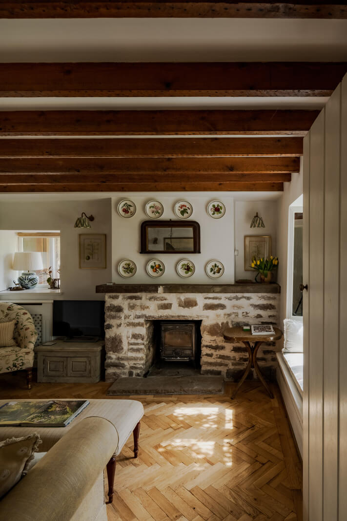 Ochre Yellow and Green Tones in a Cozy Welsh Cottage 11 living room wooden ceiling beams