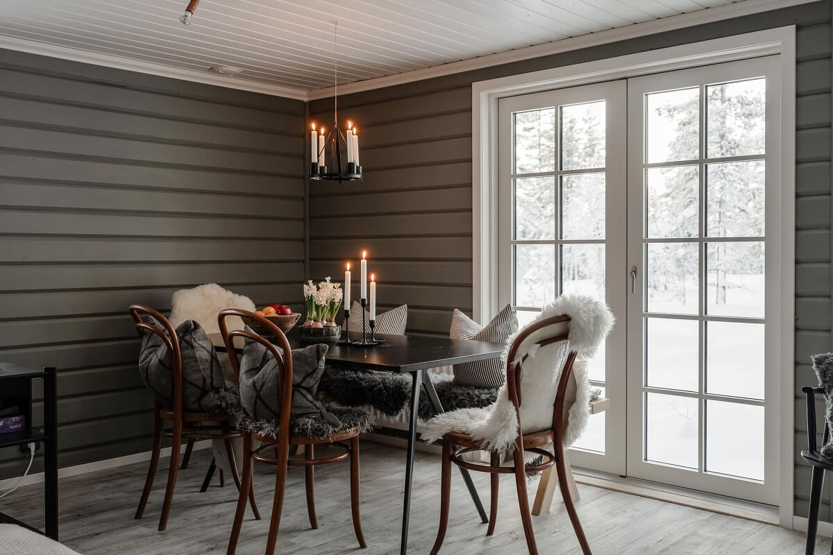 A Gray Swedish Log House Decorated for Christmas 6 log house dining table