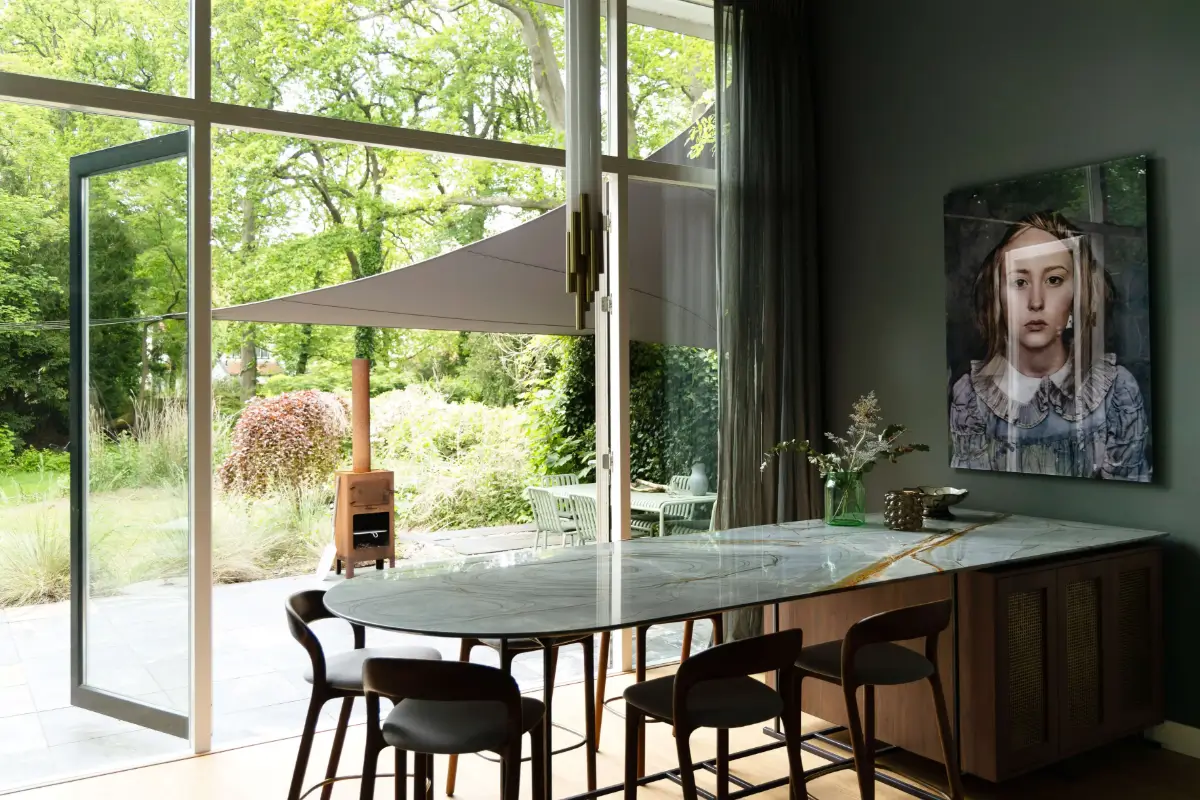 A Warm Atmosphere in a Historic Dutch Villa 12 marble-kitchen-bar-table-garden-doors