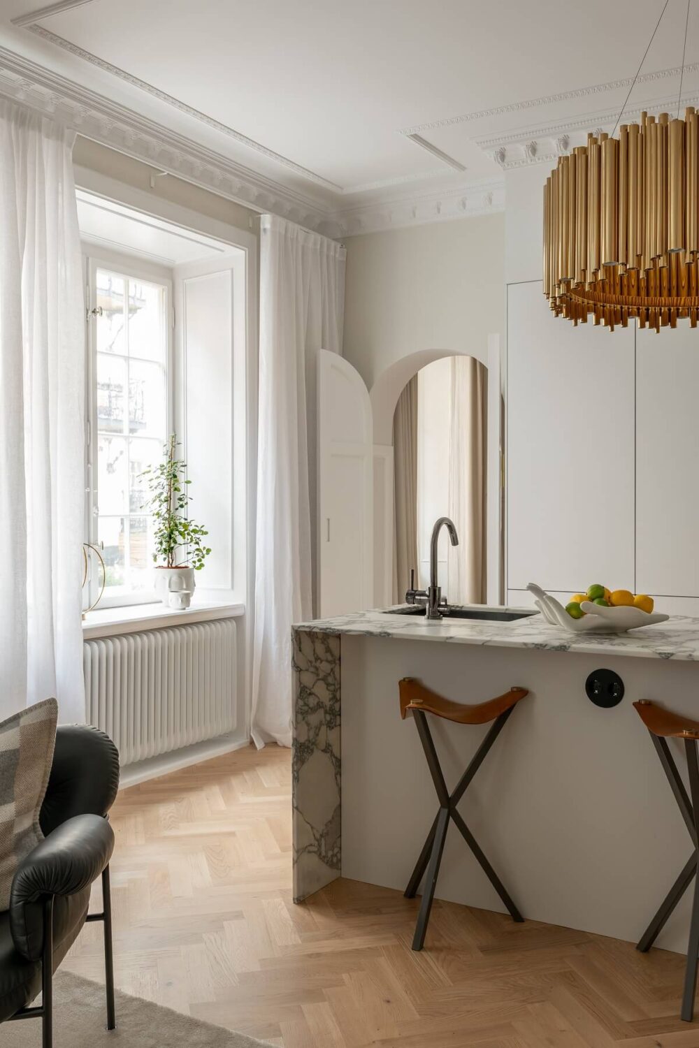 A Classic Look for a Swedish Apartment 6 marble kitchen island