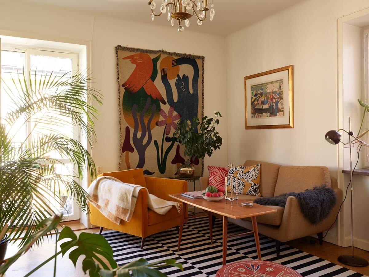 A Vintage Apartment with a Vibrant Blue Bedroom 1 midcentury living room with striped rug