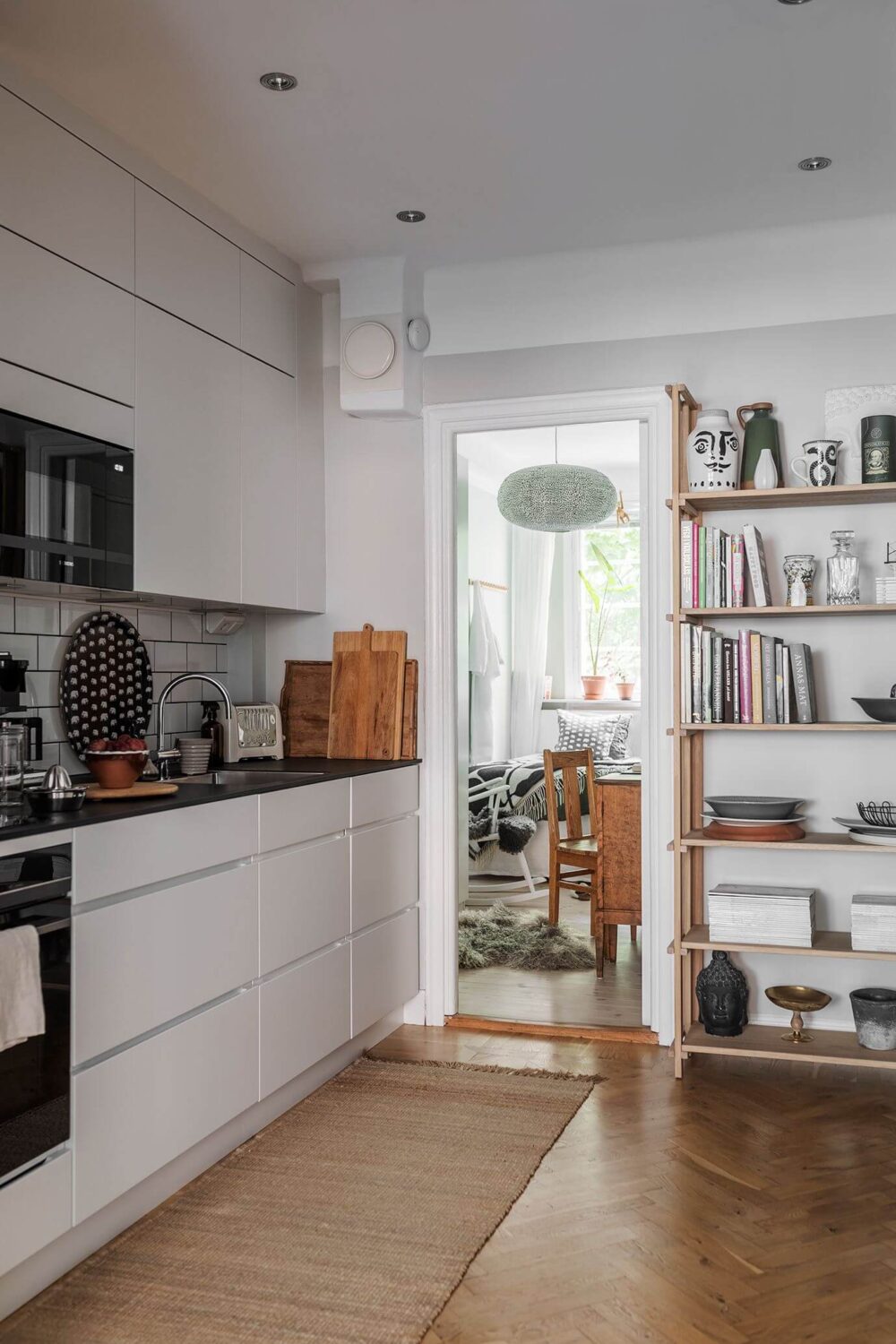 A Small Renovated 1920s Apartment in Stockholm 7 minimalistic white kitchen