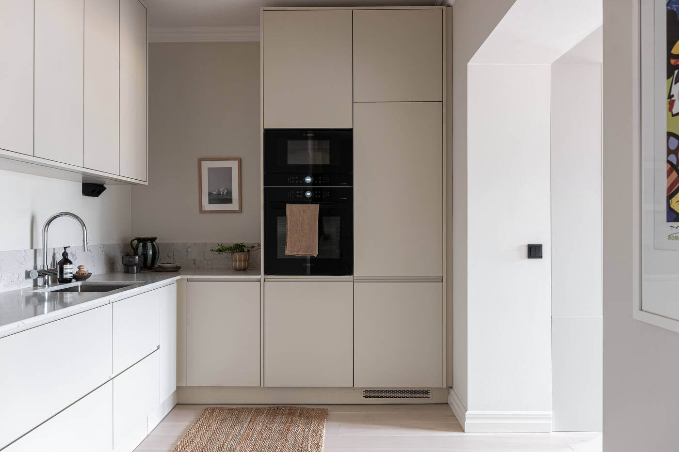 A Stylish Renovated Stockholm Apartment with Built-In Storage 8 minimalistic white scandinavian kitchen