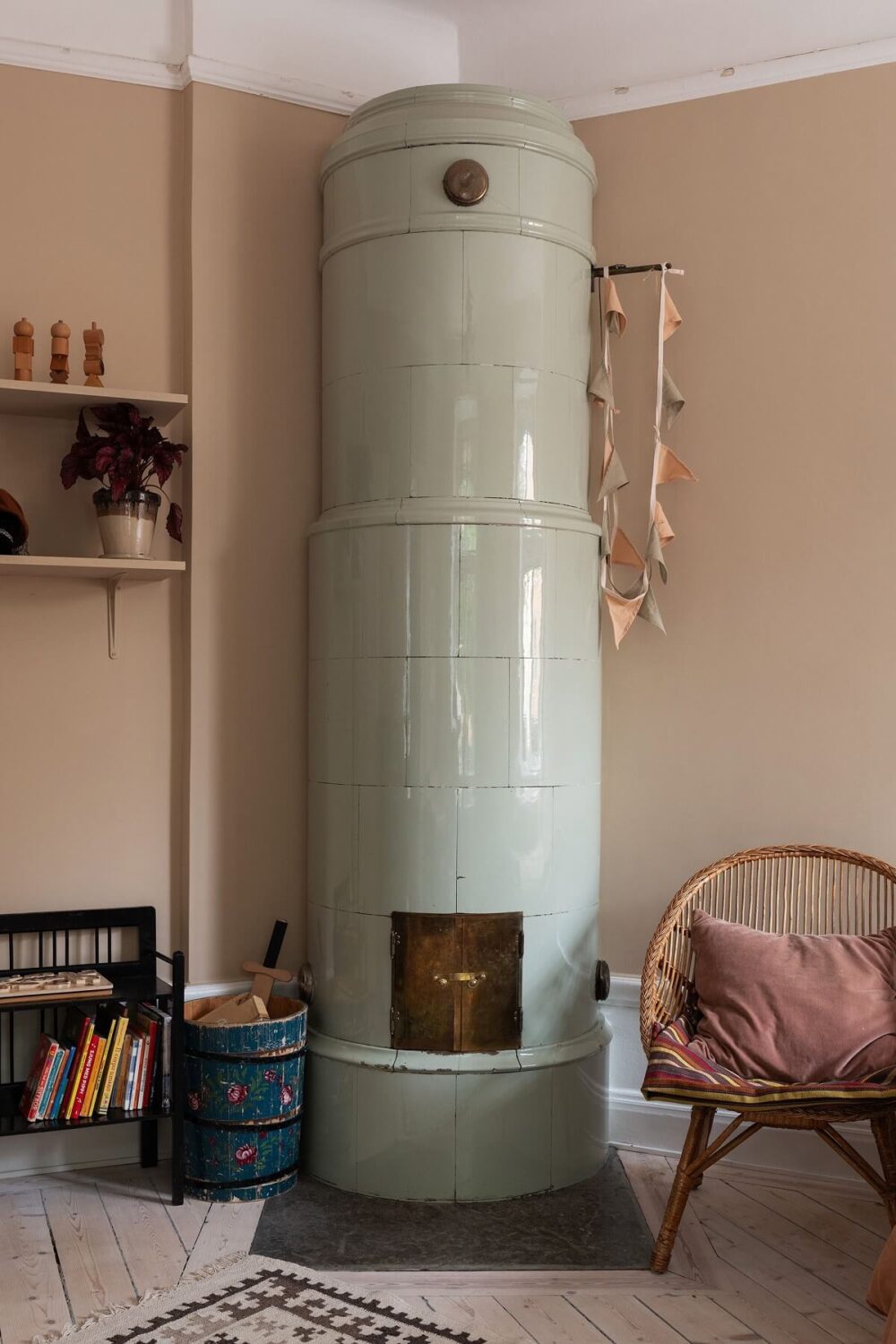 A Swedish Apartment with a Yellow Kitchen 15 mint green fireplace in pink room