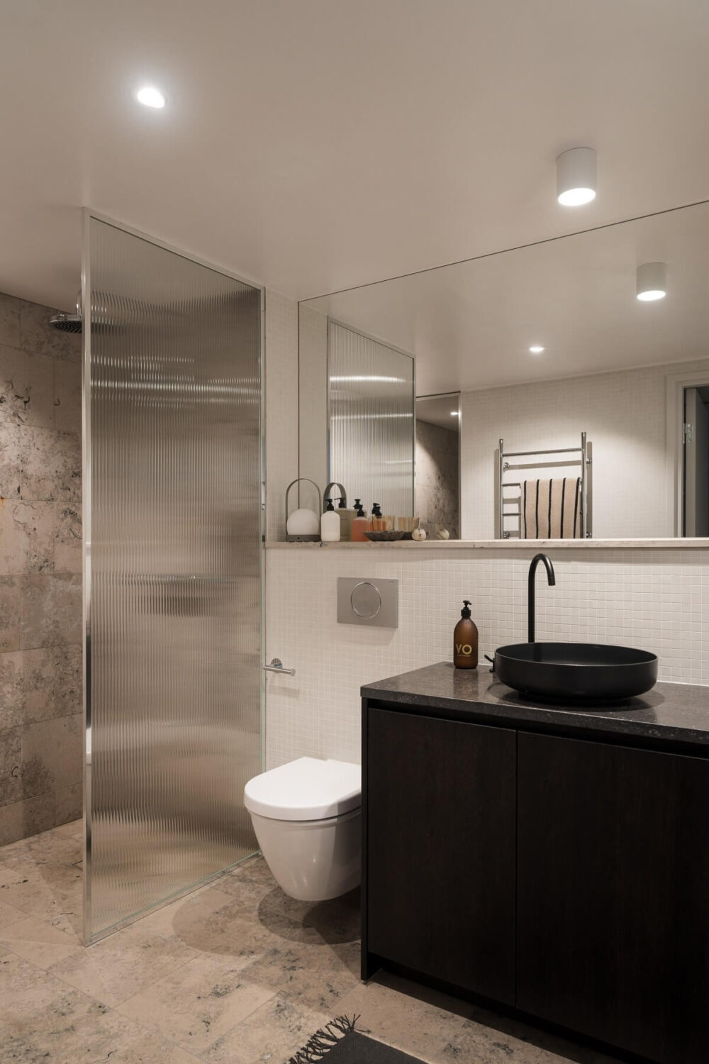 A Monochrome Loft with High Ceilings and Art 39 modern bathroom with rubbed glass shower wall
