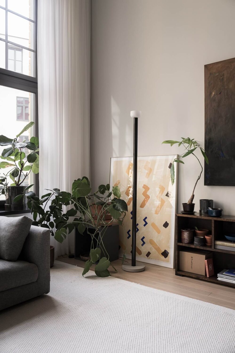 A Monochrome Loft with High Ceilings and Art 4 monochrome living room with art and plants