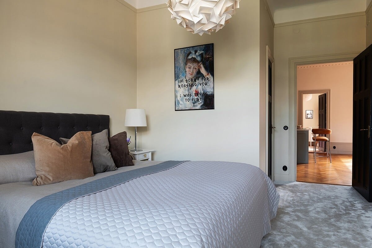 An Elegant Turn-of-the-Century Apartment in Stockholm 26 muted tones bedroom with light gray carpet nordroom