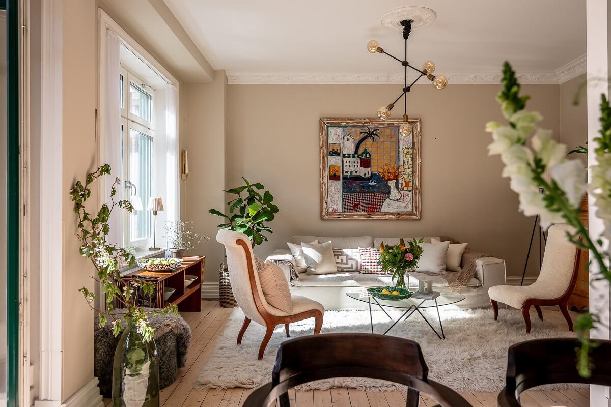 A Turn of the Century Apartment with a Green Kitchen 2 natural light in beige living room