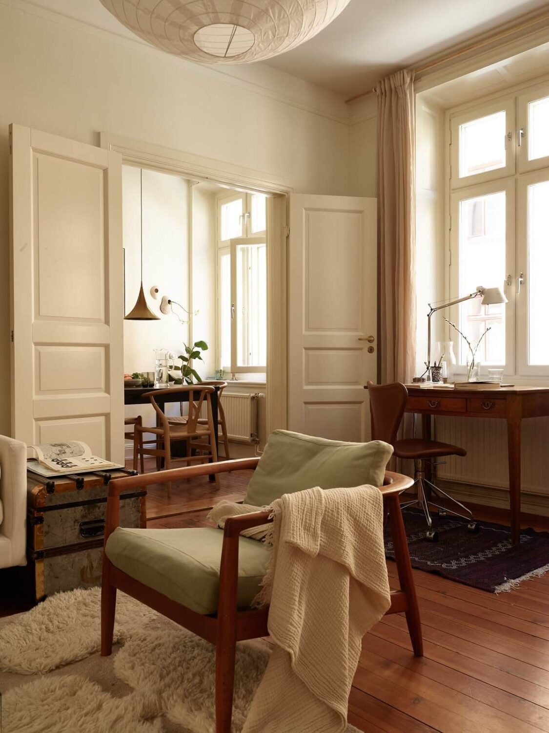 Warm Tones and a Blue Hallway in a Stockholm Apartment 5 natural wood tones in warm living room