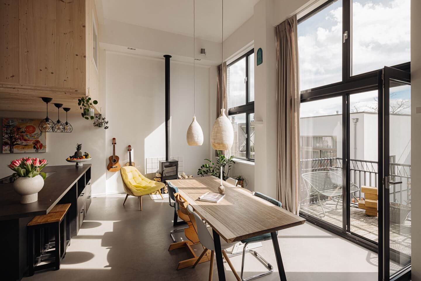 A Modern Loft-Style School Conversion in Amsterdam 6 open plan kitchen dining with roof terrace