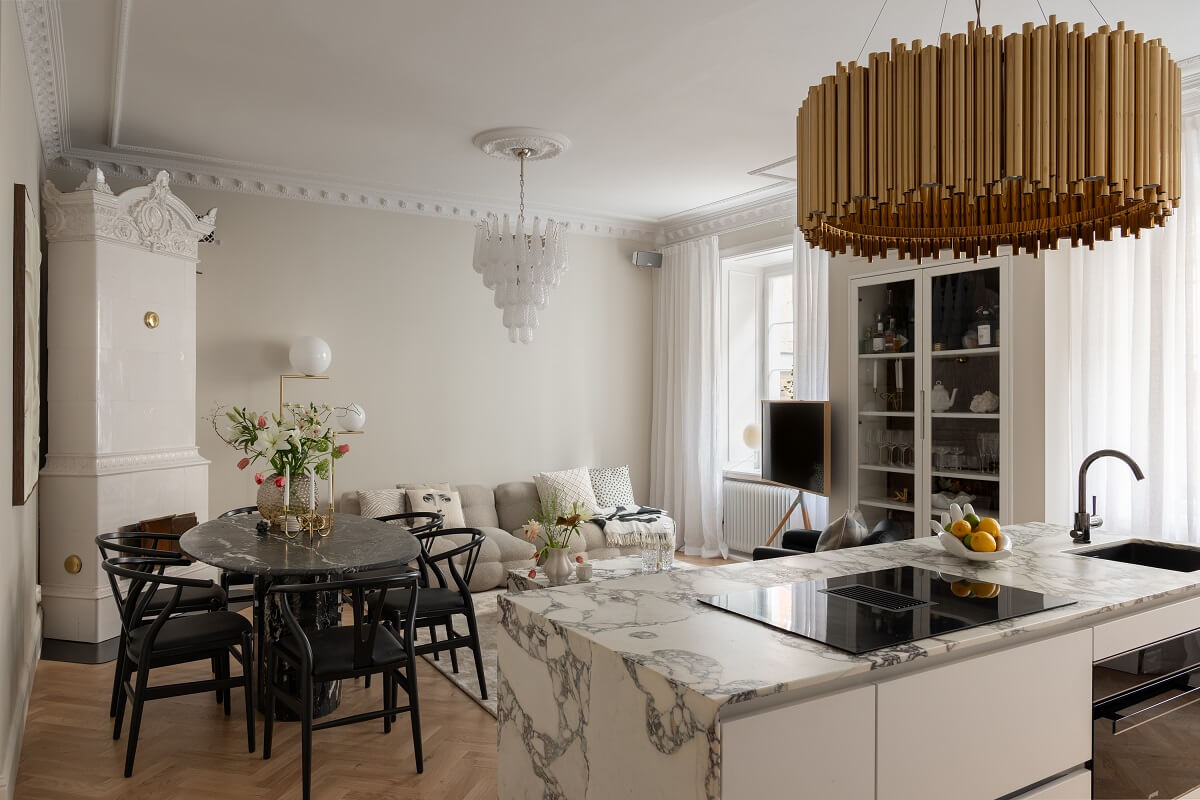 A Classic Look for a Swedish Apartment 3 open plan kitchen living roo with marble worktop and fireplace nordroom