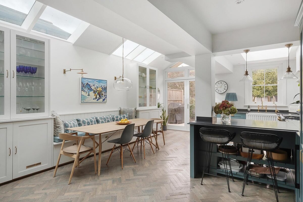 A Victorian House with a Blue deVOL Kitchen 5 open plan kitchen with built in bench and skylights