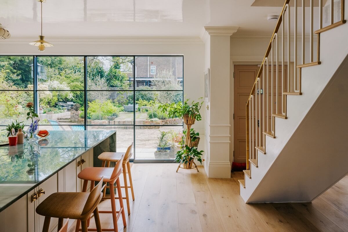 A White English House with a Beautiful Open-Plan Kitchen 5 open plan ktichen with bar seating