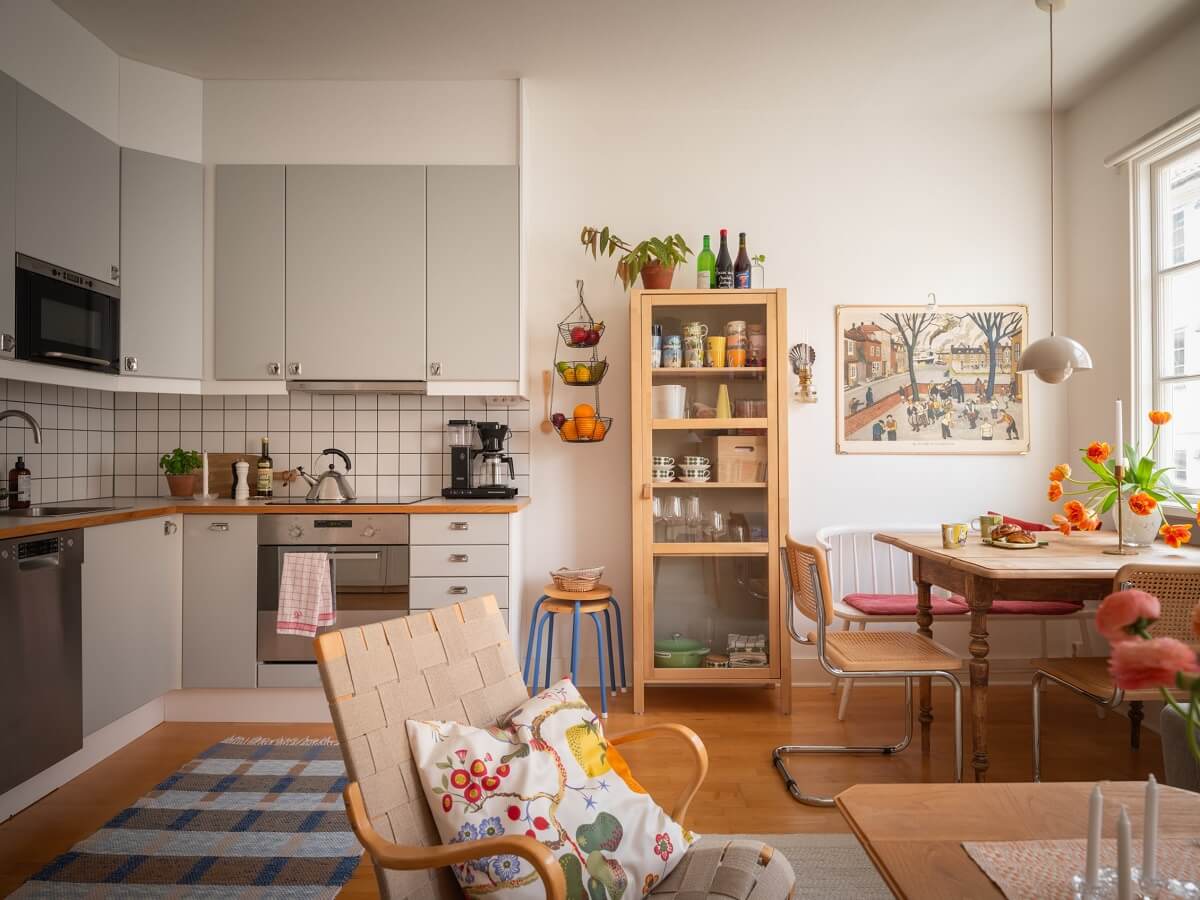 Warm Orange Tones in a Small Apartment 7 open plan living room kitchen