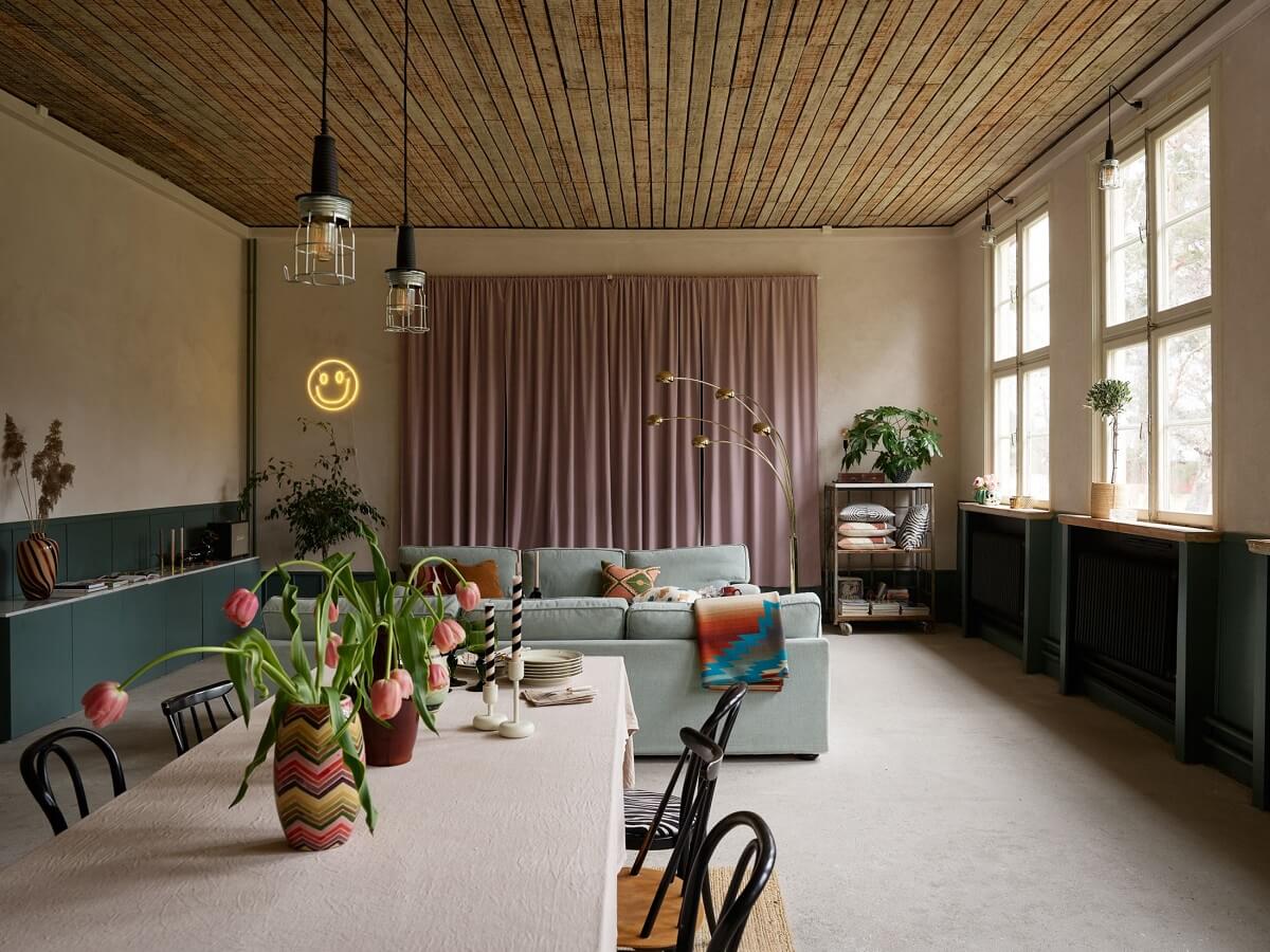 A Charming School Conversion in Sweden 10 open plan living space wooden ceiling