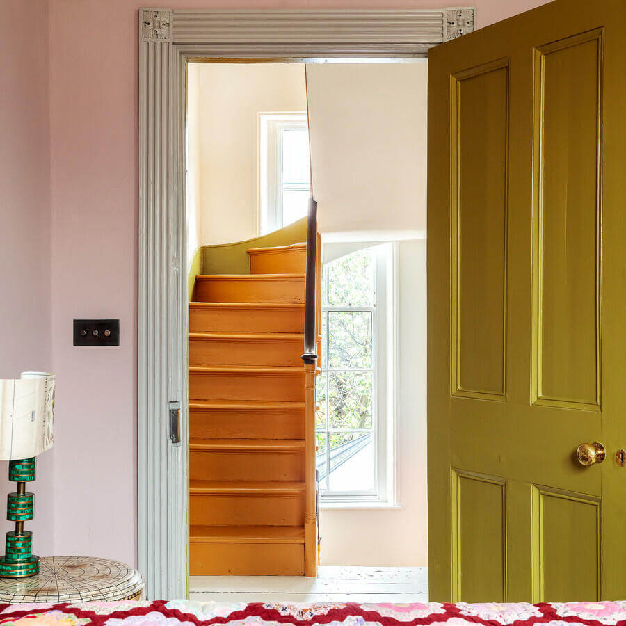 Unique Color Combinations and Design in a London Townhouse 18 orange staircase and green door