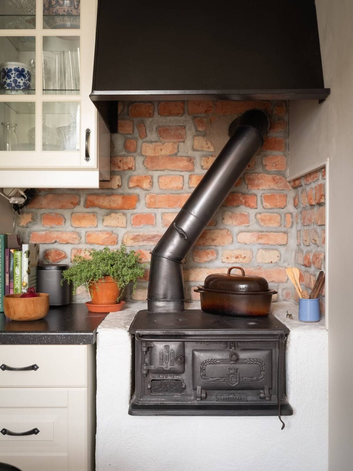 Original Details in a Light-Filled Swedish Apartment 8 original stove swedish apartment brick wall