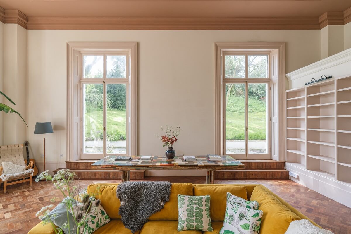 Grand Rooms and Vibrant Colors in an English Country Home 3 painted ceiling in large living room with yello sofa norroom