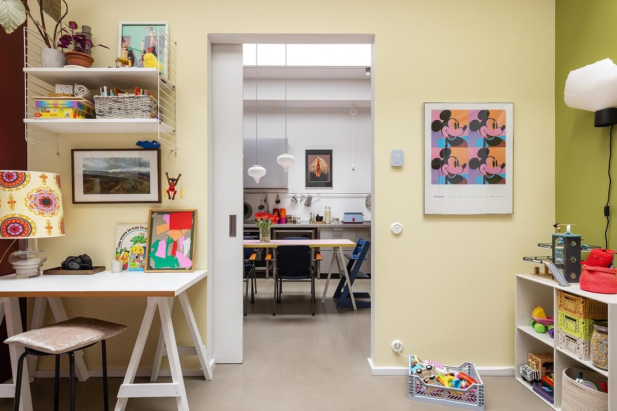 A Unique Basement Apartment in Stockholm 23 pale yellow wall and desk kids bedroom