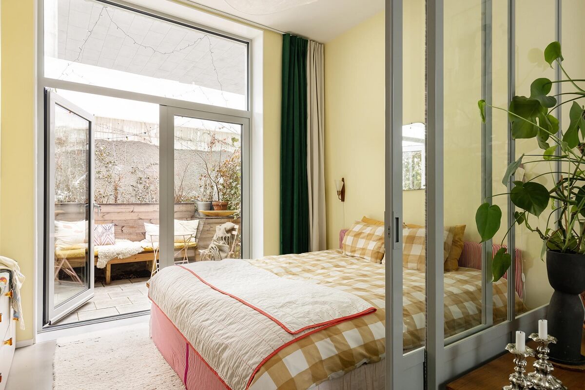 A Unique Basement Apartment in Stockholm 8 pale yellow walls bedroom