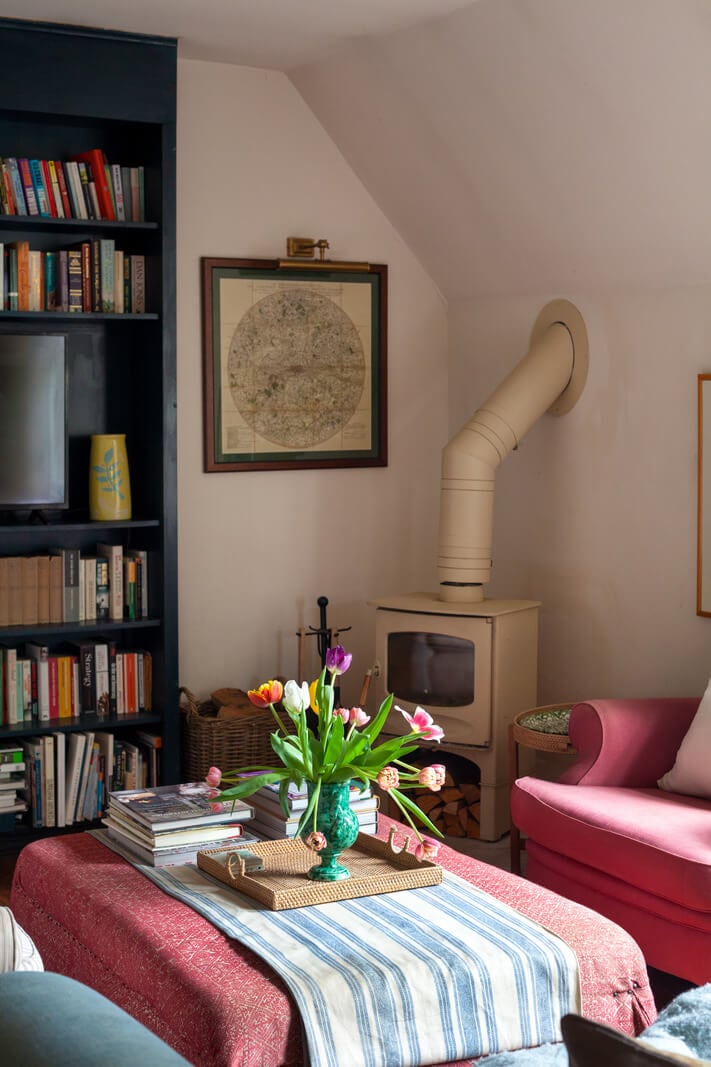 Charming Cottage Style in a London Maisonette 3 pink armchair cottage living room with wood burner nordroom