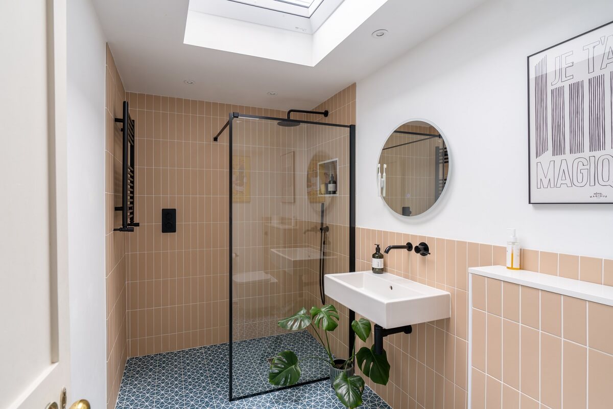 A Tiny Maisonette with Original Details in London 11 pink bathroom with skylight