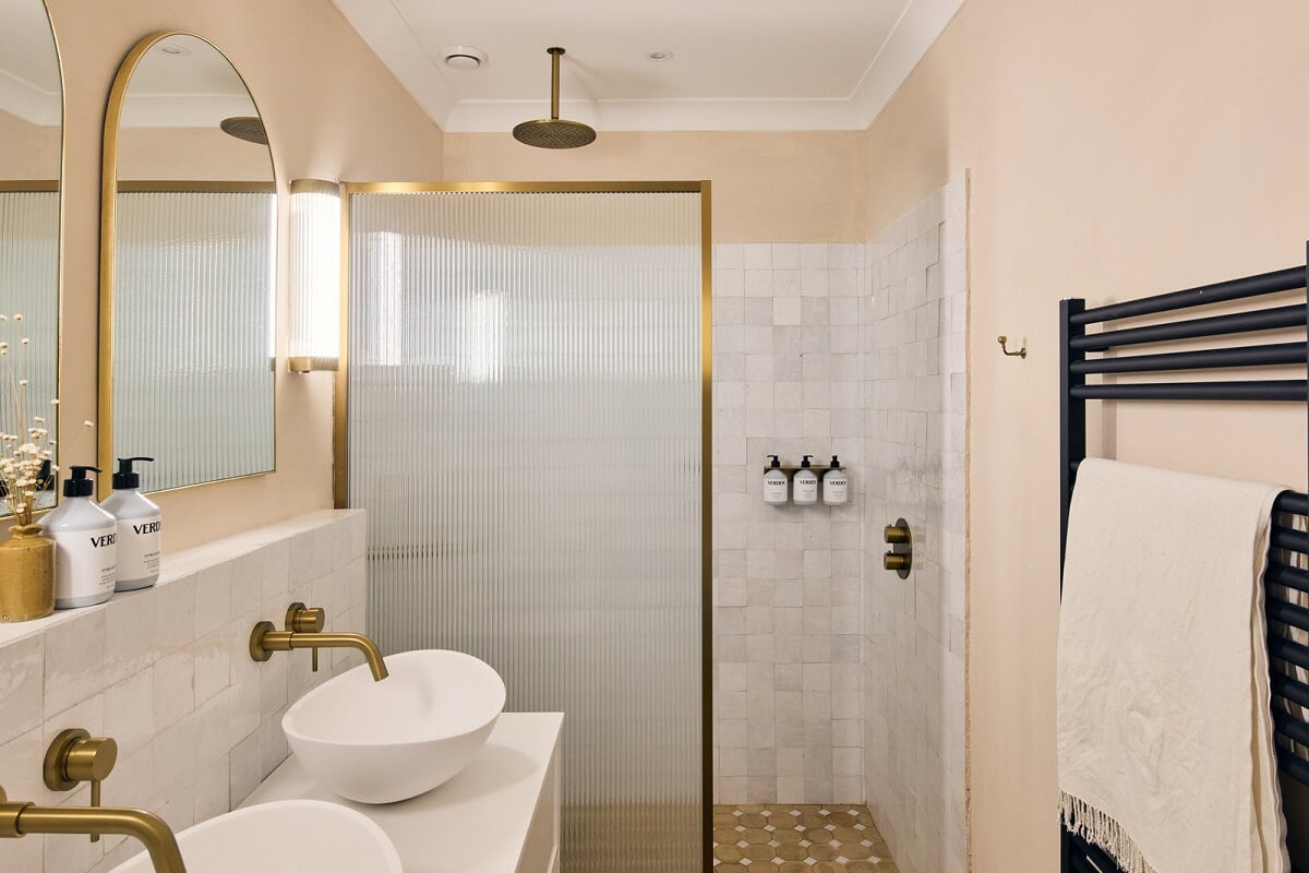 A Light Garden Apartment in London's Poet's Corner 17 pink bathroom with walk in shower and brass fittings