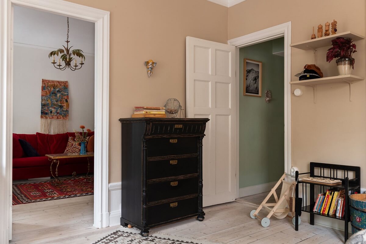 A Swedish Apartment with a Yellow Kitchen 11 pink room with vintage dresser