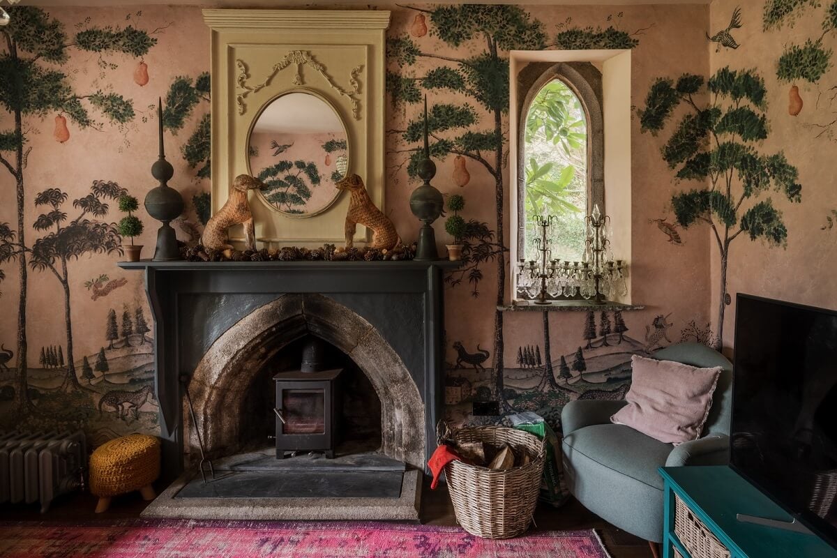A Charming Gothic-Style Home with Original Details 3 pink sitting room with fireplace and house of hackney wallpaper nordroom