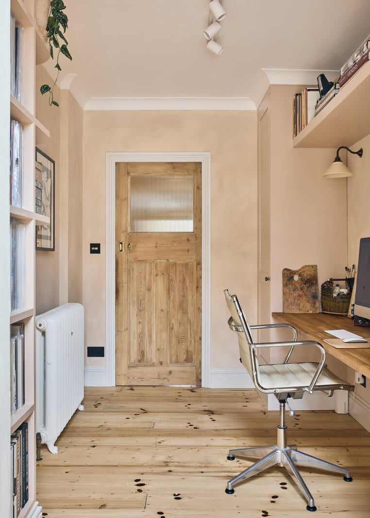 A Light Garden Apartment in London's Poet's Corner 5 plaster pink walls home office with wooden floor and floating desk