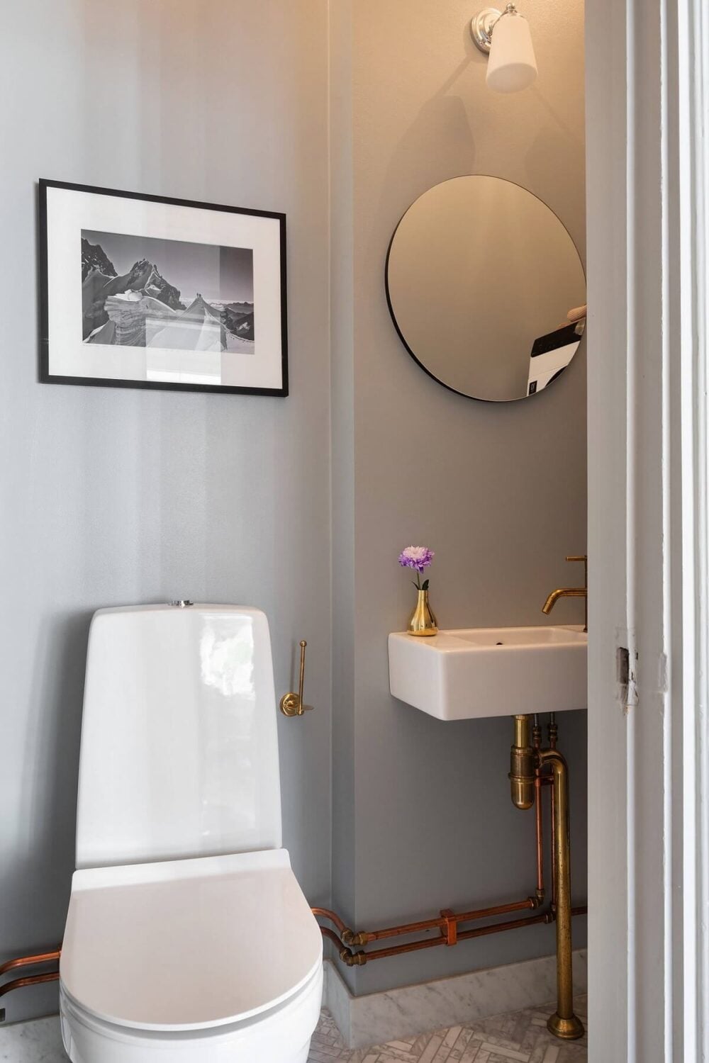 An Elegant Turn-of-the-Century Apartment in Stockholm 34 powder room with gray walls