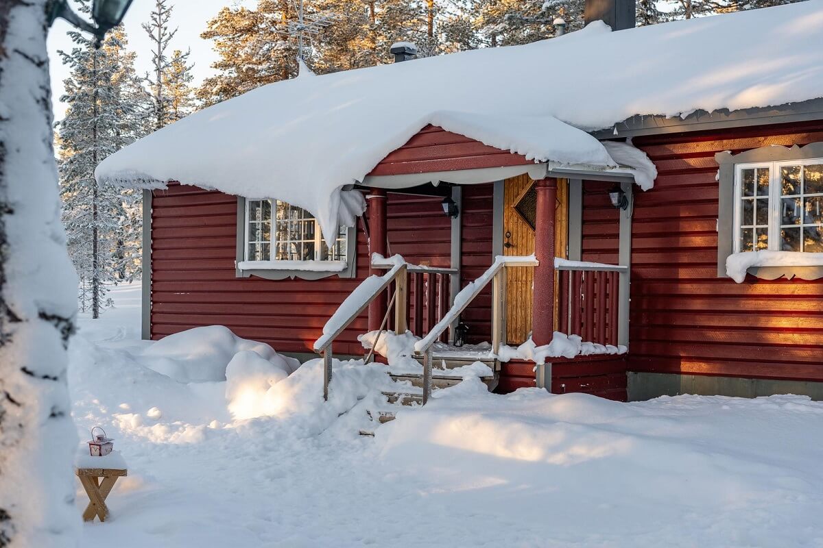 A Gray Swedish Log House Decorated for Christmas 19 red wooden log house cottage
